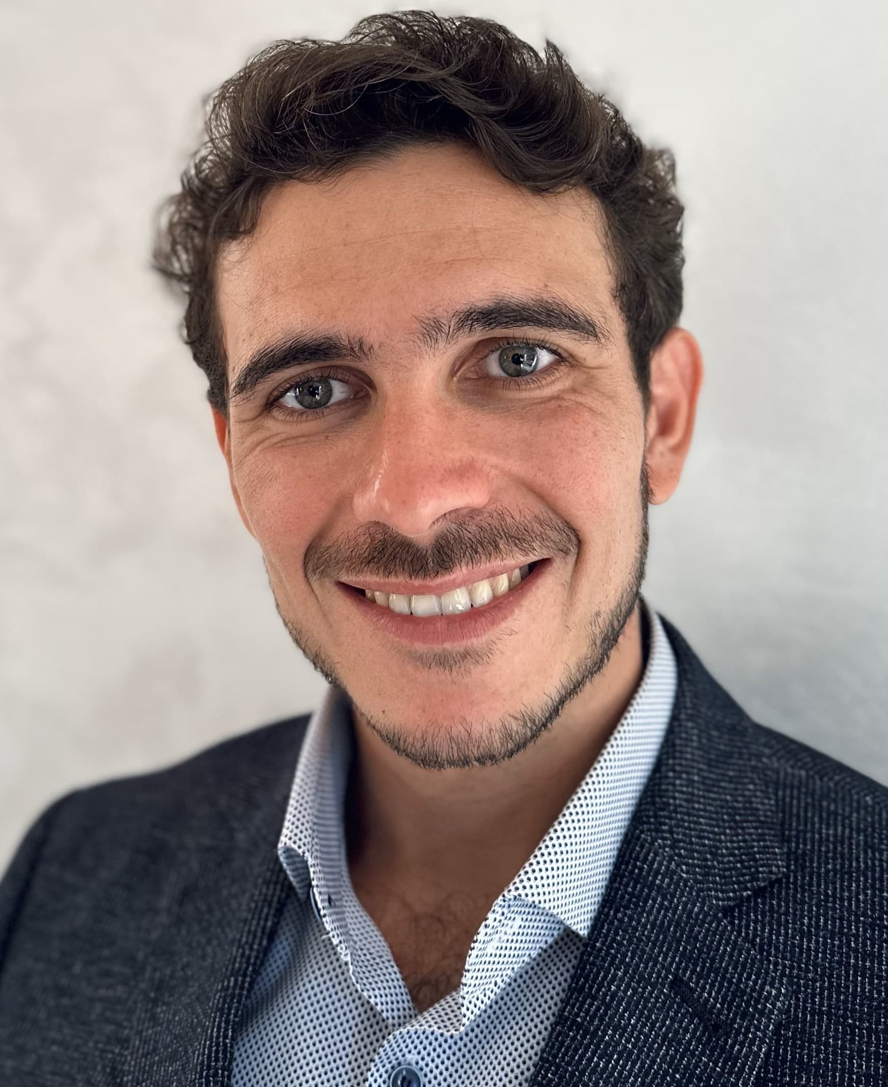 Jeremy Vian, a hardware and software engineer, smiling professionally